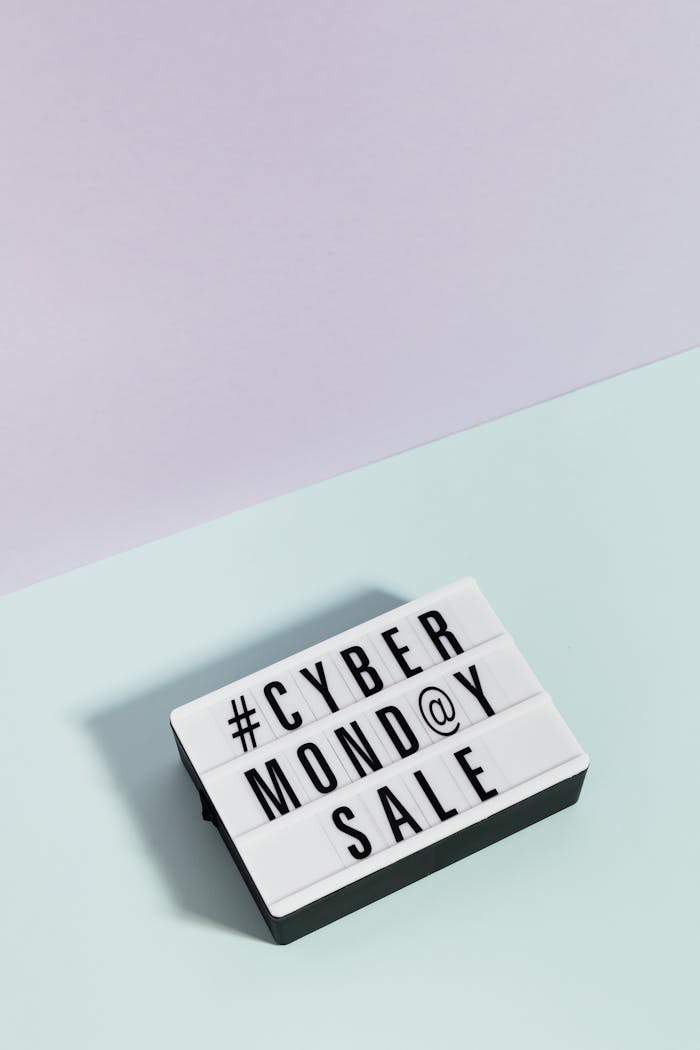 A minimalist lightbox showcasing 'Cyber Monday Sale' against a pastel background, perfect for online shopping promotions.